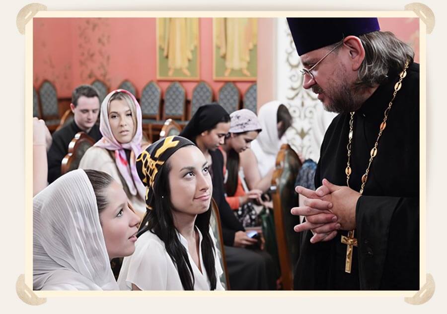 священник